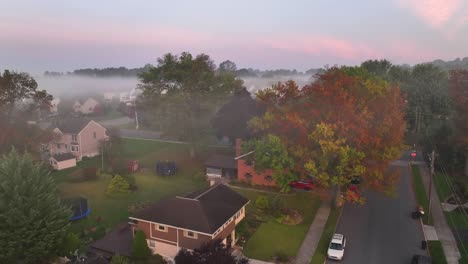 foggy neighborhood during autumn sunrise