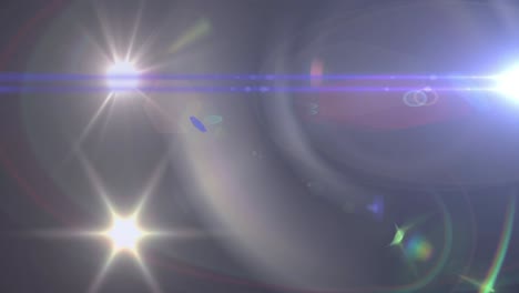 animation of spotlight with lens flare and light beams moving over dark background