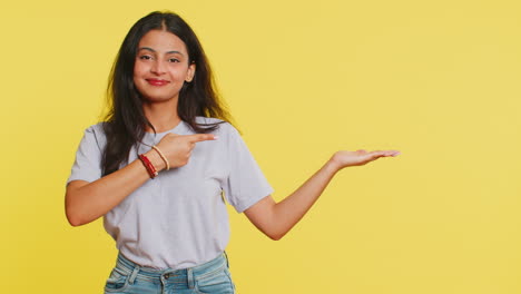 Young-woman-showing-thumbs-up-and-pointing-at-right-on-blank-space-place-for-your-advertisement-logo