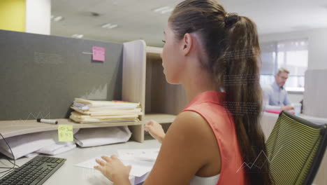 Animation-of-financial-data-processing-over-caucasian-businesswoman-working-in-office