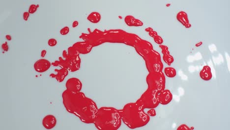 red color drops on a white background.