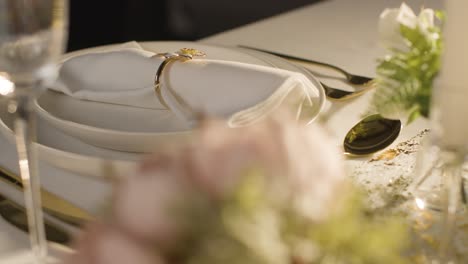 Close-Up-Of-Napkin-In-Ring-On-Table-Set-For-Meal-At-Wedding-Reception-2