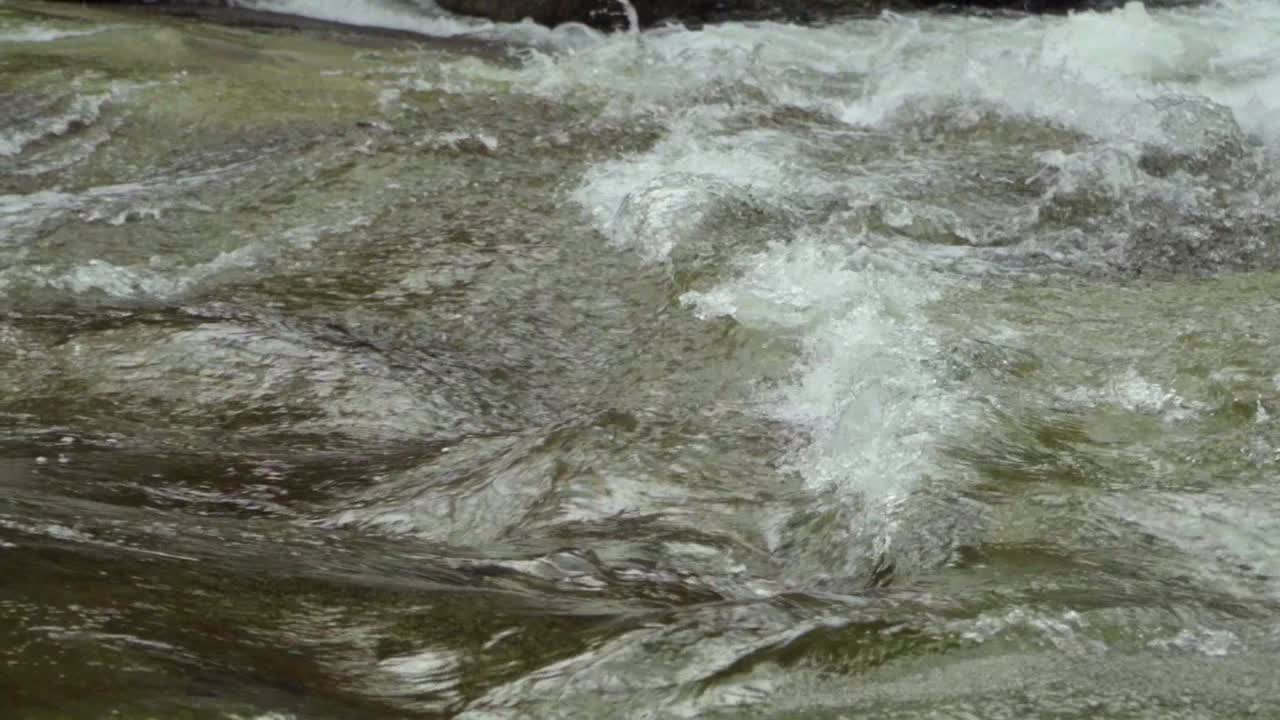 Slow motion close up up shot of rapids on a river