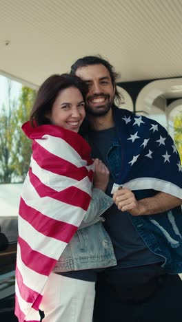 couple celebrating with american flag