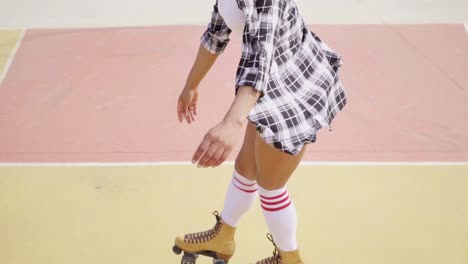 Young-woman-roller-skating-outdoors