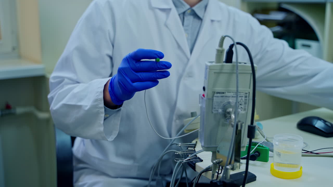 Scientist working at laboratory. Close up of researchers at work in laboratory