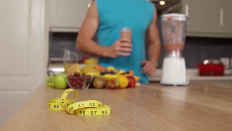 midsection of a man drinking a smoothie