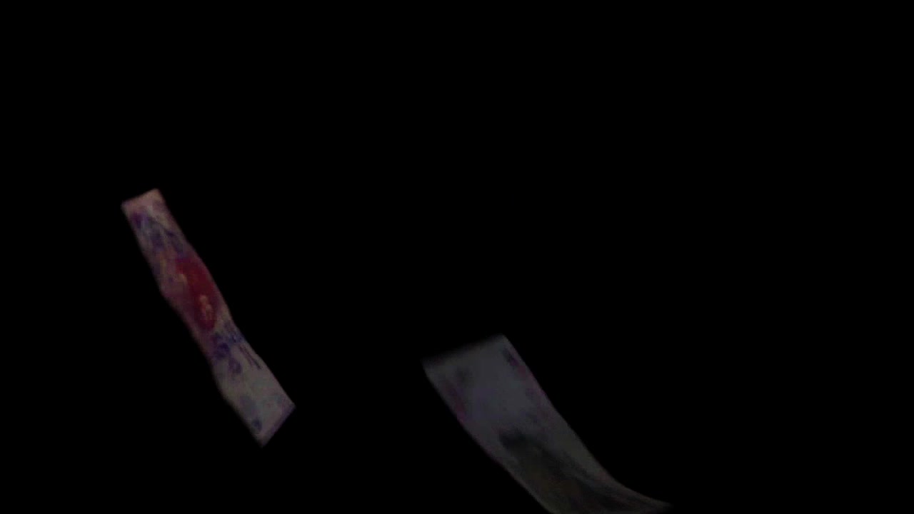 Argentinian bills of different denominations falling in slow motion