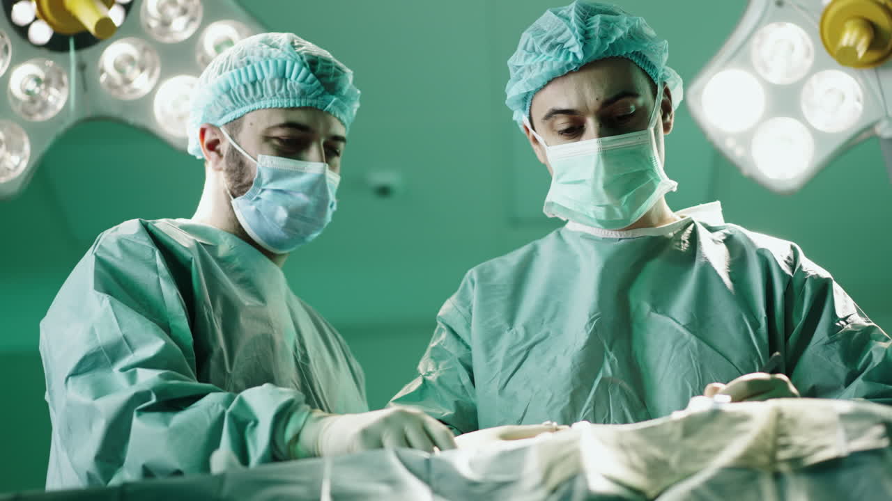 Surgeons performing surgery in operating room