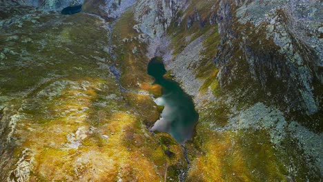 Aerial-top-down-view-of-mountain-Lake-Naret-in-Switzerland-in-spring-season