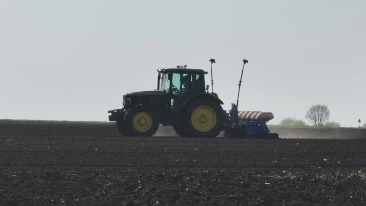 Tractor Planting Crops in Field