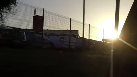 Sun-setting-behind-a-secure-parking-area-in-West-Bank,-East-London,-South-Africa