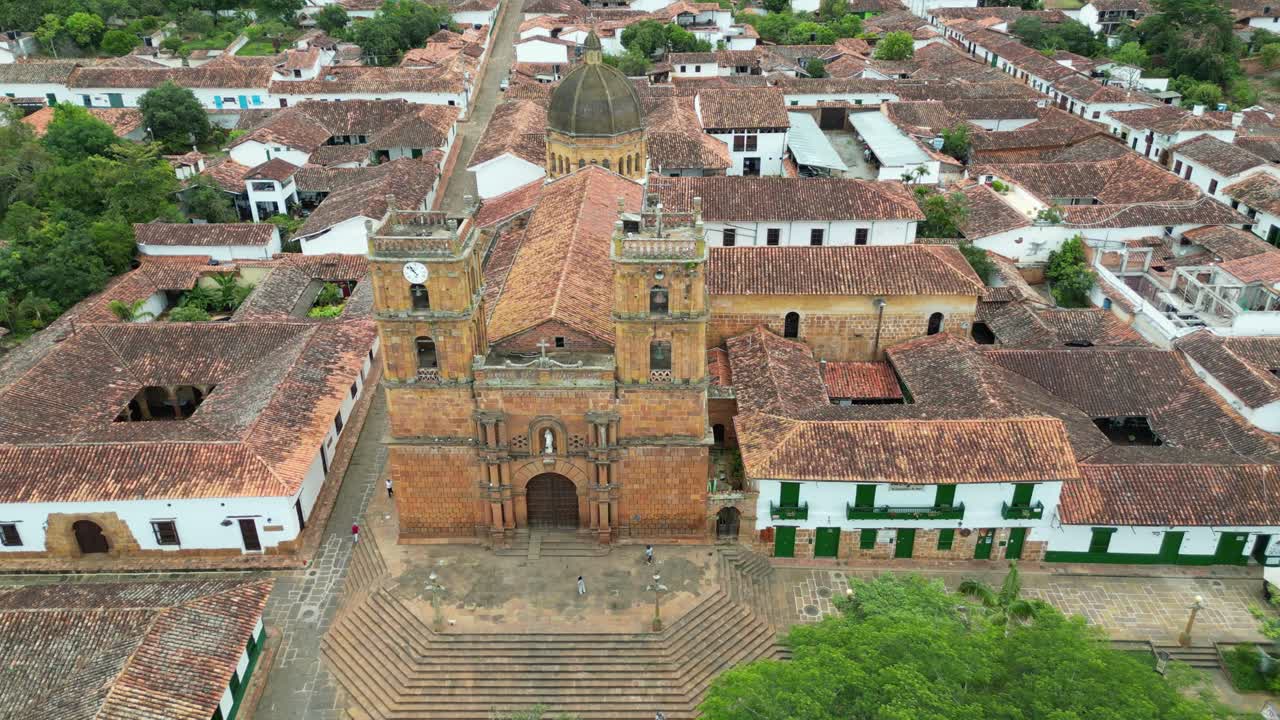 Aerial view of the Parish Church of the Immaculate Conception in the Andean village of Barichara in the Santander Department of Colombia, surrounded by colonial clay houses with red-tiled roofs