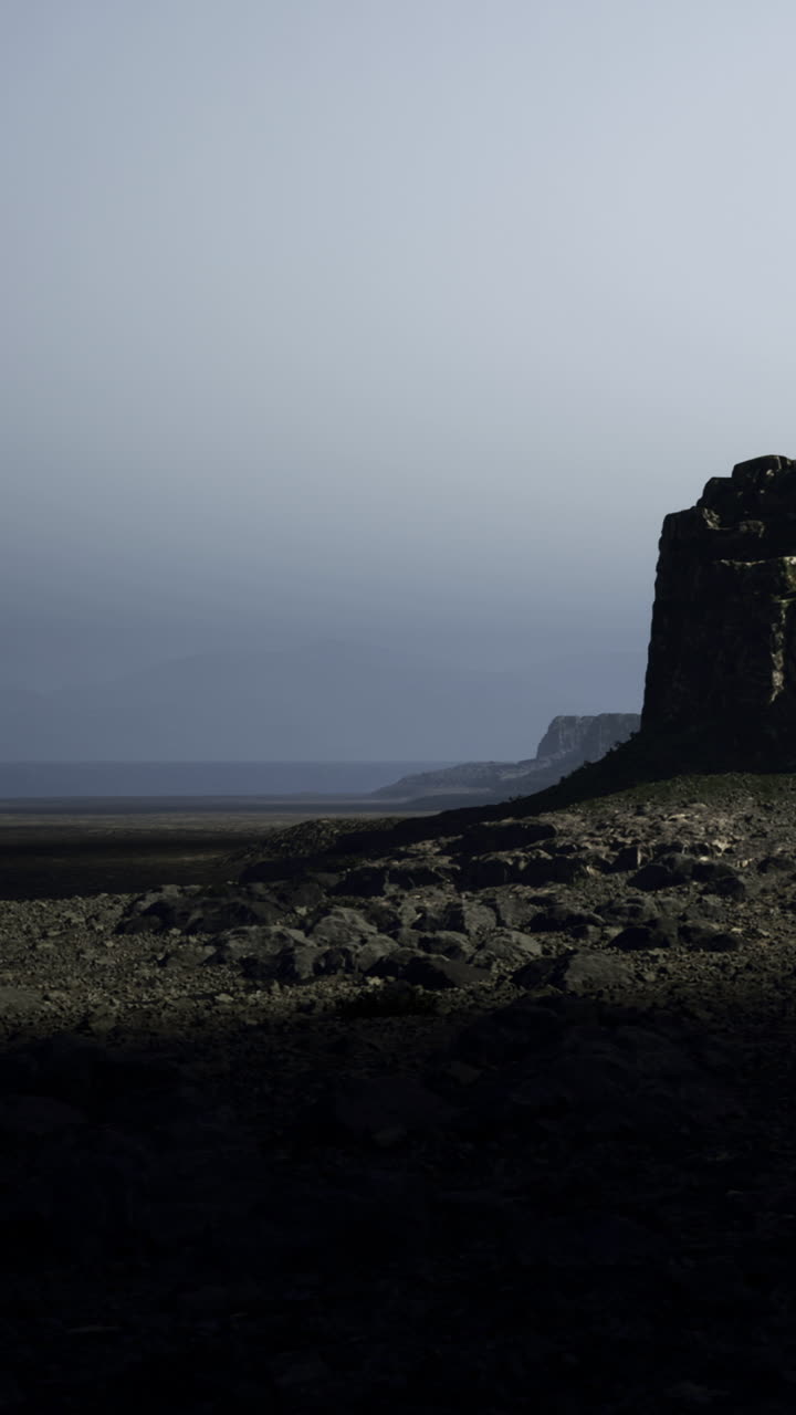 Rock formation on a shoreline during twilight near the ocean