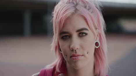 close up portrait young punk girl student pink hair looking serious independent caucasian woman alternative fashion style urban background colorful eccentric