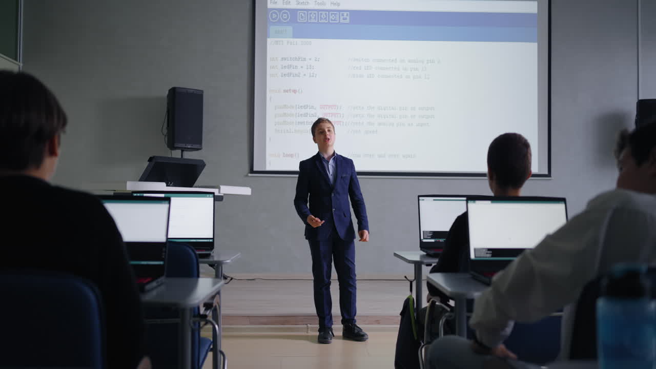Teenager Presenting in a Computer Science Classroom