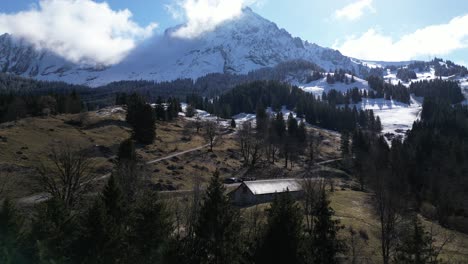 View-of-the-village-of-Frontalpstock-in-Glarus-Switzerland,-which-is-in-a-green-valley-at-the-base-of-the-Alps-is-stunning