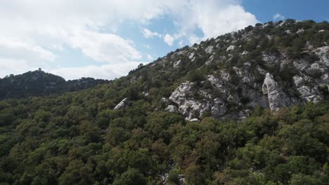 daytime aerial view over cloudy mountains drone panoramic shot of thermessos, antalya, turkey