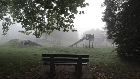 scary empty playground park with sitting bench