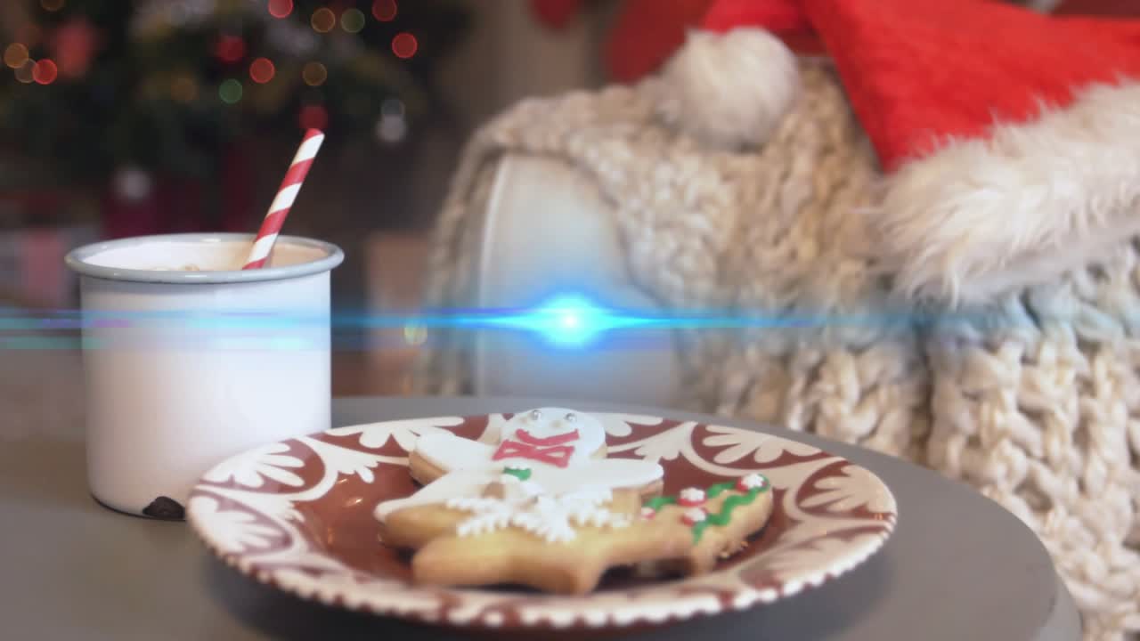 Camera shifting downward revealing enamel mug beside star cookies, lens flare sweeping holiday glow