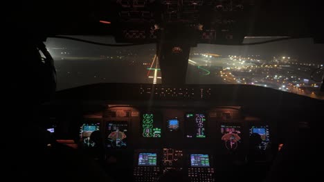 exclusive night view of a jet cockpit during the landing to valencia international airport