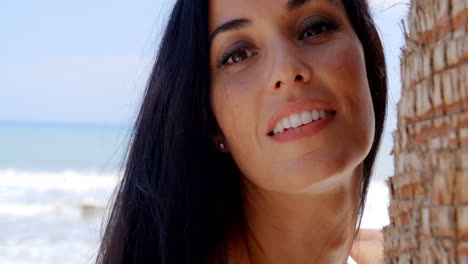 close up woman at the beach looking at the camera