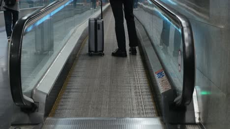 tourist man with suitcase baggage in spain, a traveler with luggage suit jacket on business street go to a hotel, business office, airport terminal, enjoying the vibrant atmosphere