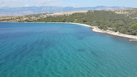 an aerial footage over adriatic sea on island pag, croatia near mandre