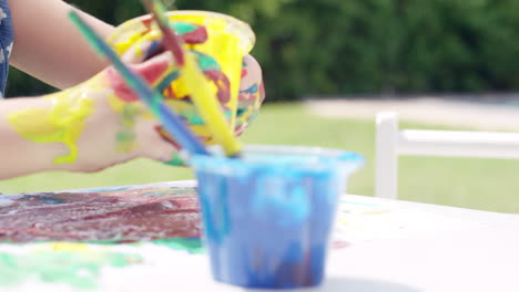 cute preschooler learning how to paint little girls painting on face