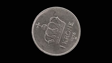 norway 1976 1 krone coin reverse with large crown and denomination above date rotating on black background
