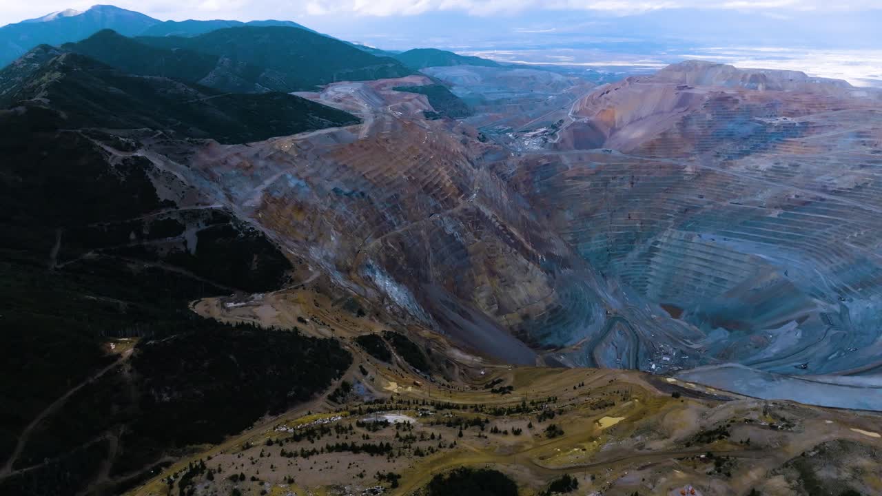 Premium stock video - Bingham copper mine - pullback aerial view at dusk