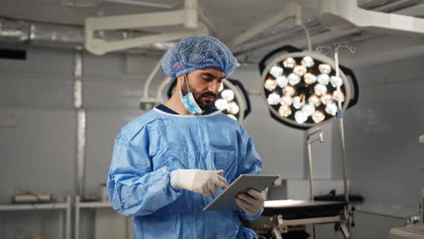 Surgeon reviewing data in operating room