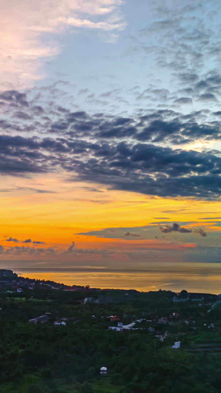 Dramatic Sunset Skies Over Coastal Village. - vertical, timelapse