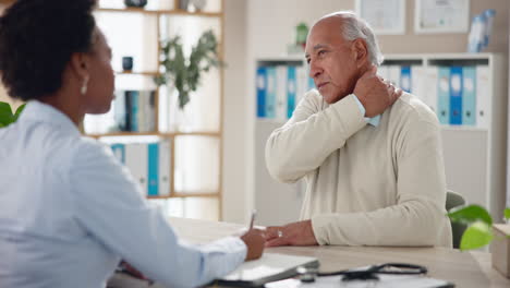 doctor consulting with elderly patient about shoulder pain