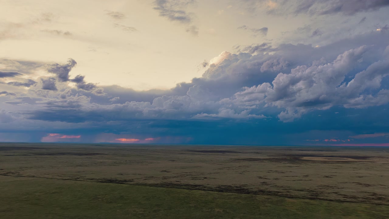 Aerial view over beautiful landscape scene and sunset storm clouds 4k drone footage