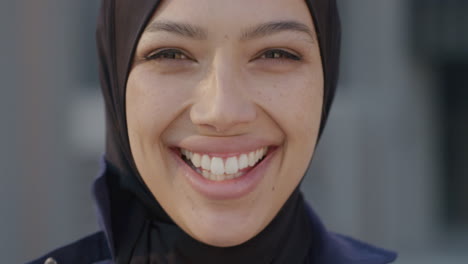 portrait beautiful asian muslim woman smiling in city urban scene