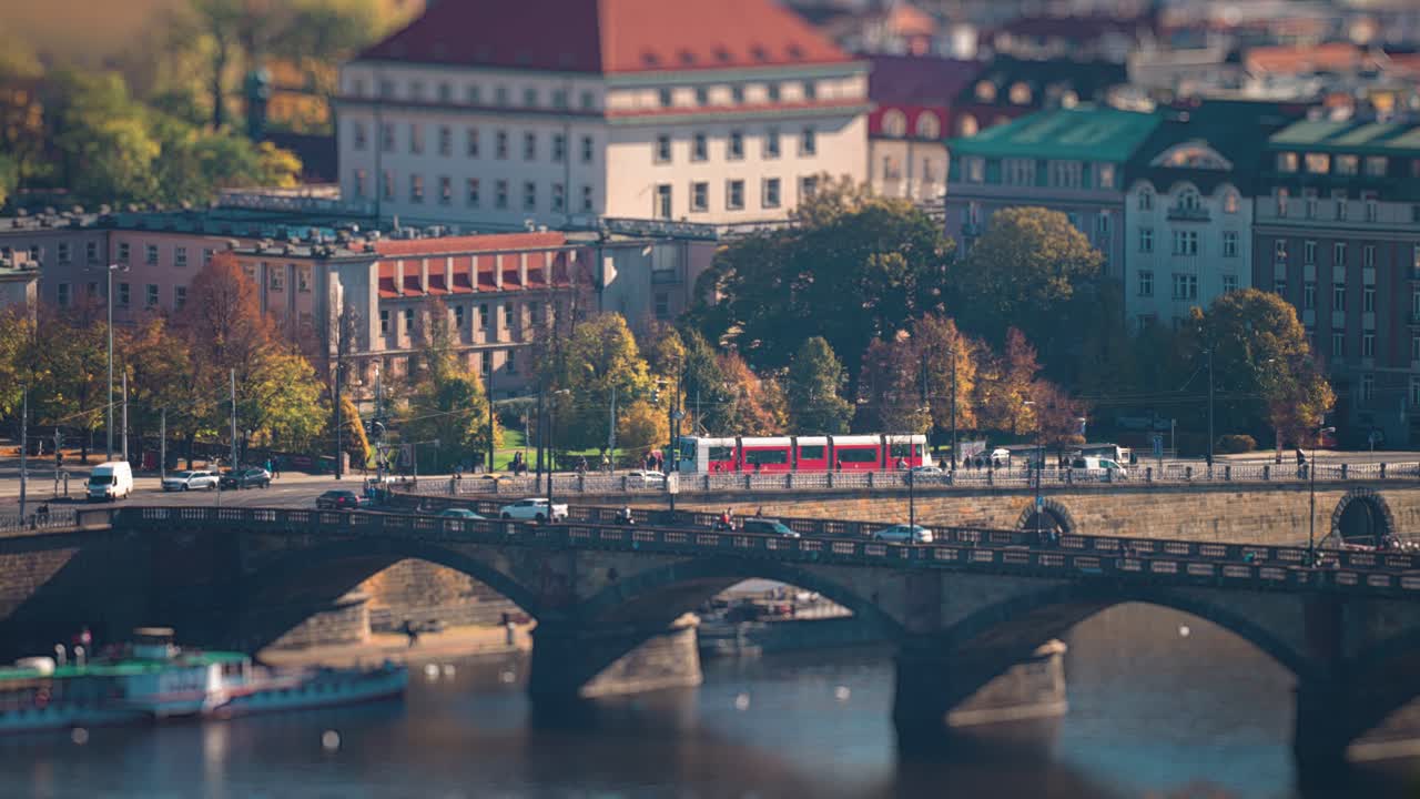 Miniaturized trams and cars move along miniaturized bridges and streets in Prague's city center