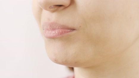 woman eating dried apricots in close-up. dry fruits.