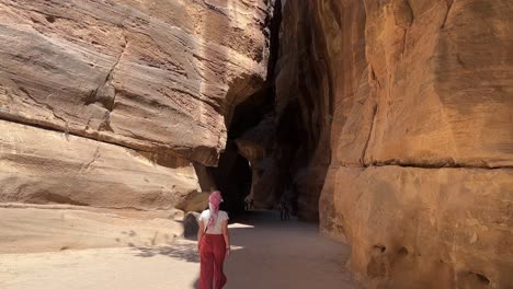 Tall-Women-walking-in-Petra-in-Wadi-Musa,-close-to-the-Treasury-of-Jordan-with-no-other-people-around-4K