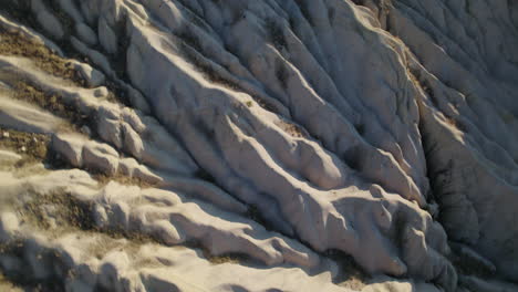 Cappadocia-Hot-Air-Balloons-flying-over-hills-during-sunset