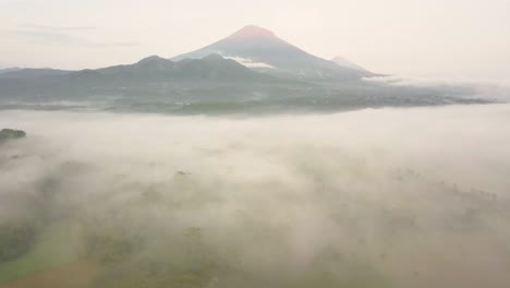 aerial view over morning mist in mount sumbing, wonosobo, central java