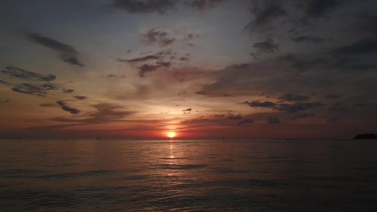 Breathtaking aerial view flight dream sunset at lonely Beach paradise island koh chang, thailand 2022. fly reverse drone
4k uhd cinematic footage.