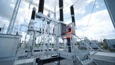 electrical engineers inspect the electrical systems at the equipment control cabinet