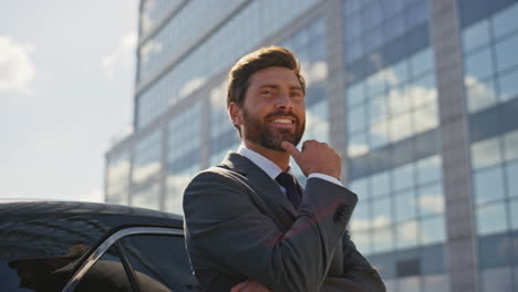 luxury car owner smiling street after buying vehicle closeup. man playing keys