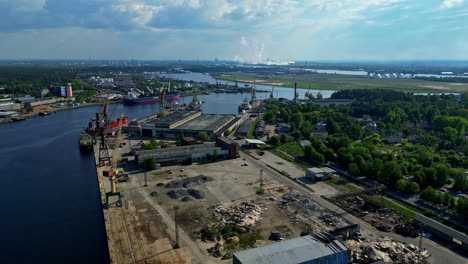 busy port with cranes loading goods onto ships