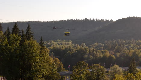 sigulda cable car tour, outdoor adventures, travel, and sightseeing various tourist attractions over the picturesque gauja national park in latvia.