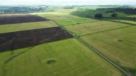 Aerial-forward-view-of-farm-fields-on-a-clear-day