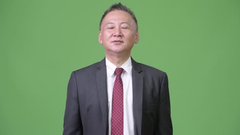 mature japanese businessman relaxing