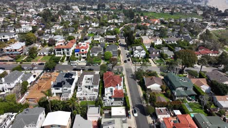 ascending aerial view of the pacific palisades, california prestigious neighborhood