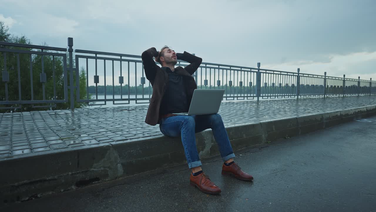 Stressed Businessman on a Rainy Day